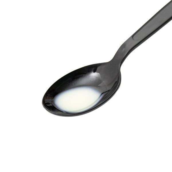 BioFe pure iron drops, 20 drops on a black spoon